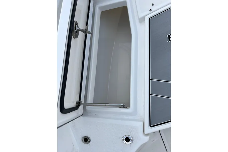  Yacht Photos Pics 2019 Blackfin 272 CC boat storage compartment with open hatch and hydraulic support.