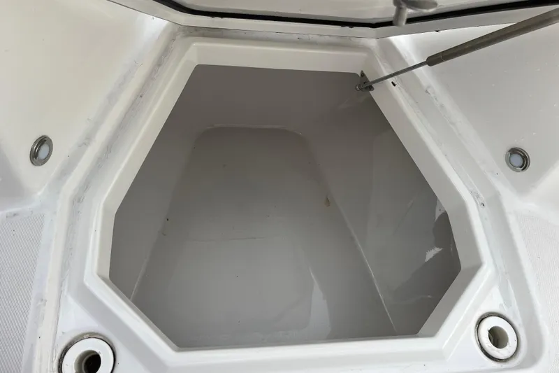  Yacht Photos Pics Storage compartment of a 2019 Blackfin 272 CC boat, open and empty.