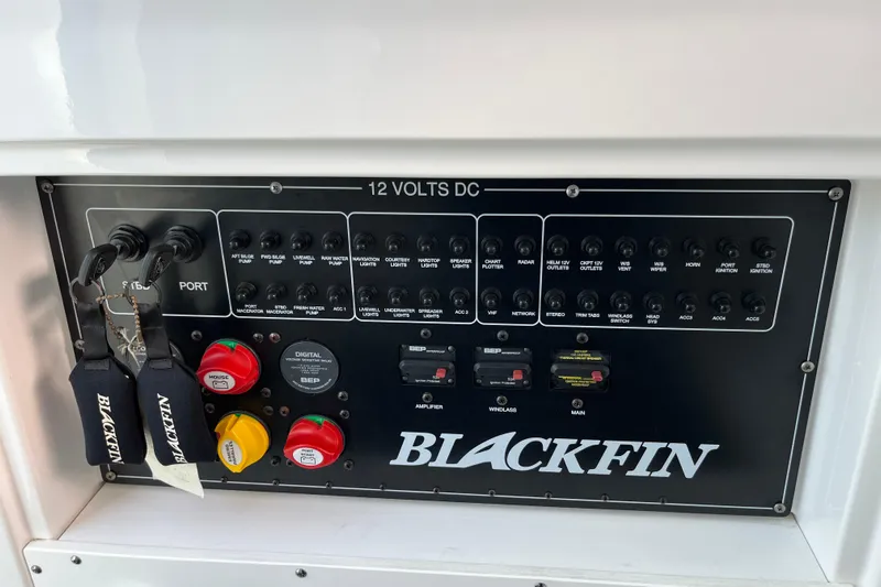  Yacht Photos Pics Control panel of 2019 Blackfin 272 CC boat with labeled switches and keys.