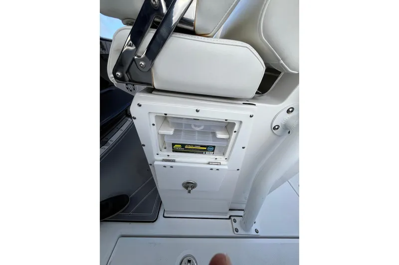  Yacht Photos Pics 2019 Blackfin 272 CC boat seat with storage compartment and tackle box.