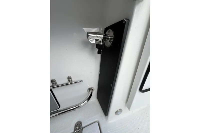  Yacht Photos Pics 2019 Blackfin 272 CC boat interior detail with chrome fittings and black panel.