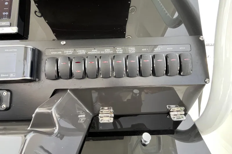  Yacht Photos Pics Control panel of a 2019 Blackfin 272 CC boat with labeled switches.