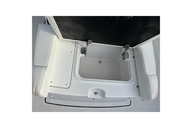  Yacht Photos Pics 2019 Blackfin 272 CC boat storage compartment with open lid and white seating.