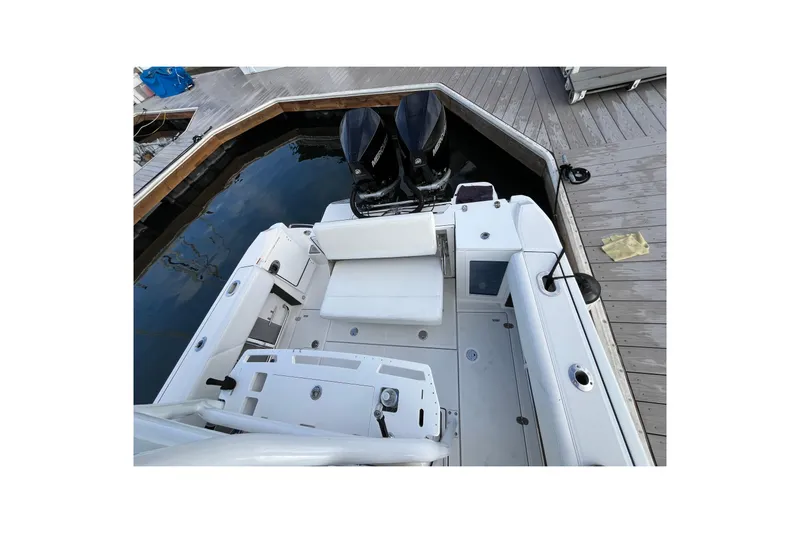  Yacht Photos Pics 2019 Blackfin 272 CC boat docked, featuring dual outboard motors and spacious seating area.