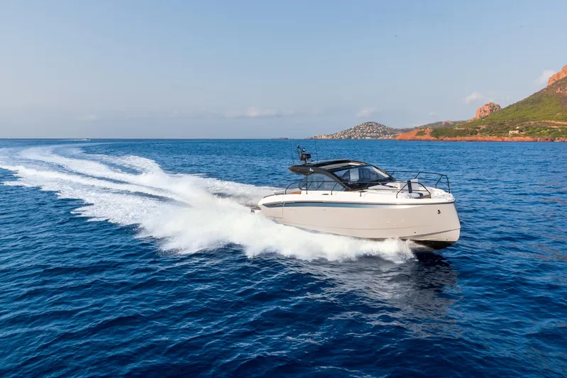  Yacht Photos Pics 2026 Beneteau Gran Turismo 40 cruising on open sea near scenic coastline.