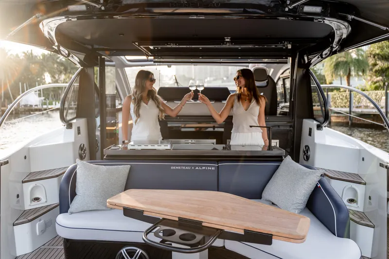  Yacht Photos Pics Women toasting on a 2026 Beneteau Gran Turismo 40 yacht, enjoying a luxurious cruise.