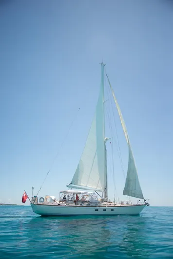 Tuatara Yacht Photos Pics Sailing yacht Little Harbor 63, 1983 model, on calm blue waters under clear sky.