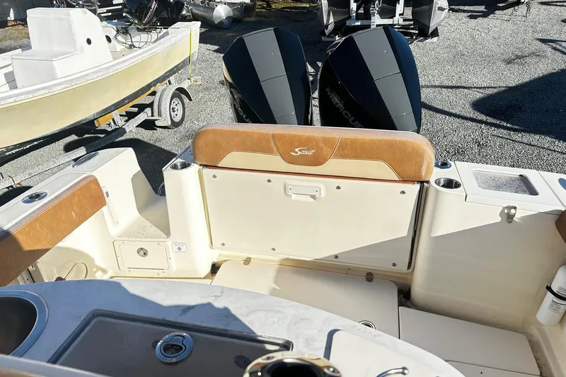  Yacht Photos Pics 2023 Scout 277 LXF boat interior with dual Mercury engines and seating area.