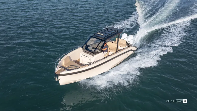  Yacht Photos Pics 2025 Rand Roamer boat cruising on open water, showcasing sleek design and powerful performance.