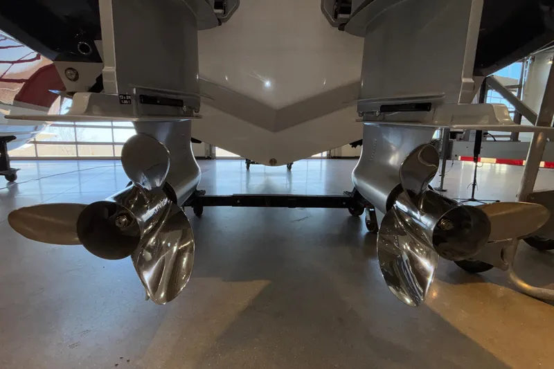  Yacht Photos Pics 2026 Monterey Elite 30 OB boat propellers in a showroom setting.