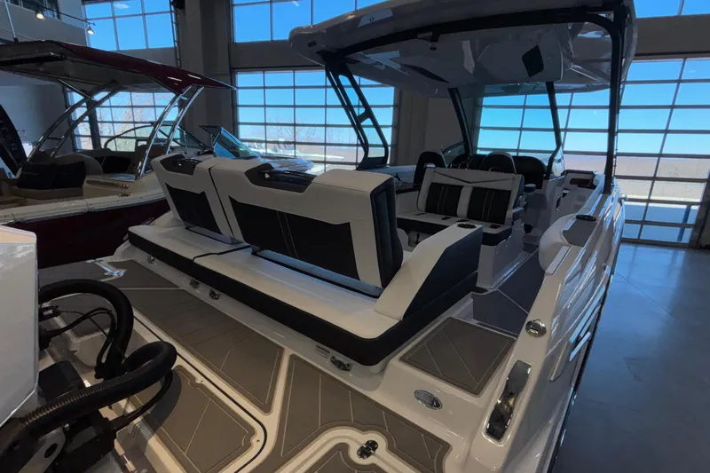  Yacht Photos Pics 2026 Monterey Elite 30 OB boat interior with luxurious seating in showroom.