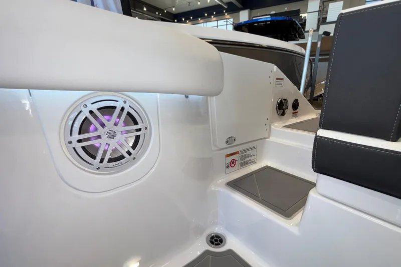  Yacht Photos Pics 2026 Monterey Elite 30 OB boat interior with speaker and seating area.