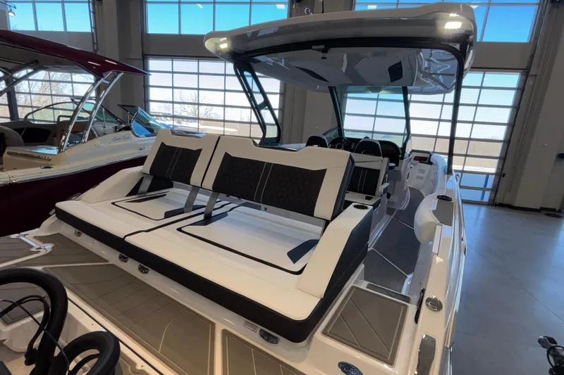  Yacht Photos Pics 2026 Monterey Elite 30 OB boat with sleek seating and modern design in showroom.