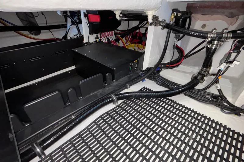  Yacht Photos Pics Engine compartment of 2026 Monterey Elite 30 OB boat, showcasing wiring and components.