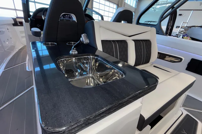  Yacht Photos Pics Luxury interior of 2026 Monterey Elite 30 OB boat with sleek sink and seating.