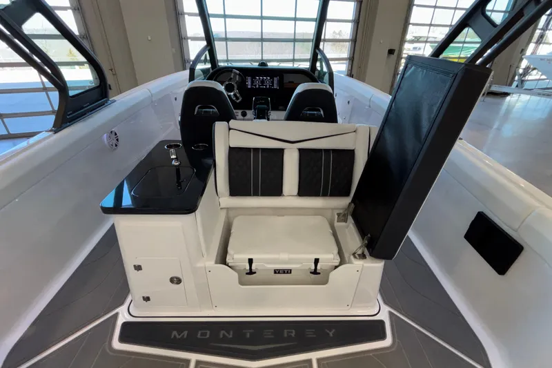  Yacht Photos Pics 2026 Monterey Elite 30 OB boat interior with seating and storage.