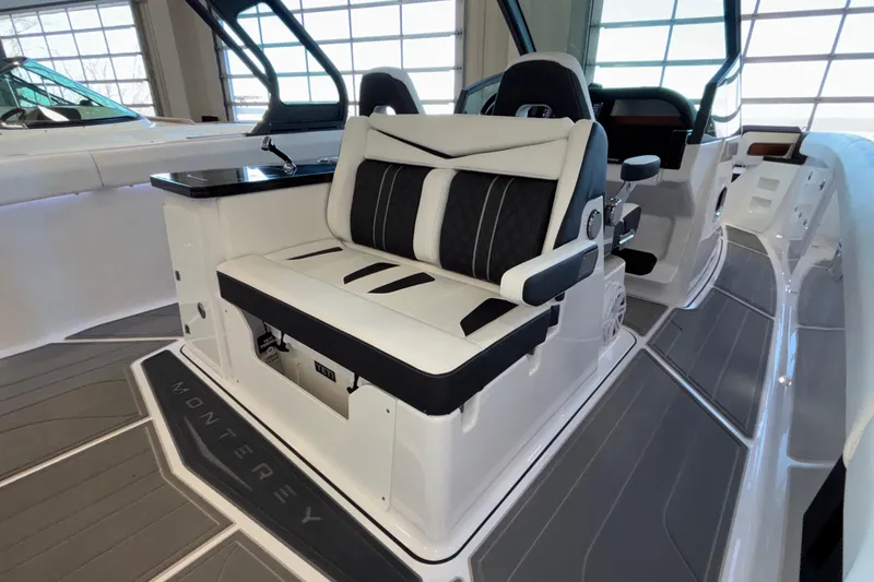  Yacht Photos Pics 2026 Monterey Elite 30 OB boat interior with luxurious seating and modern design.