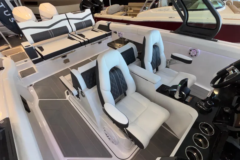  Yacht Photos Pics Luxurious interior of 2026 Monterey Elite 30 OB boat with plush seating and modern controls.
