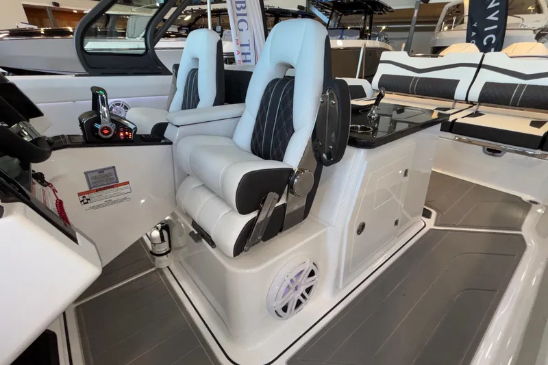  Yacht Photos Pics Luxury interior of 2026 Monterey Elite 30 OB boat with plush seating and modern controls.