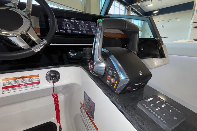  Yacht Photos Pics 2026 Monterey Elite 30 OB boat dashboard with advanced controls and steering wheel.