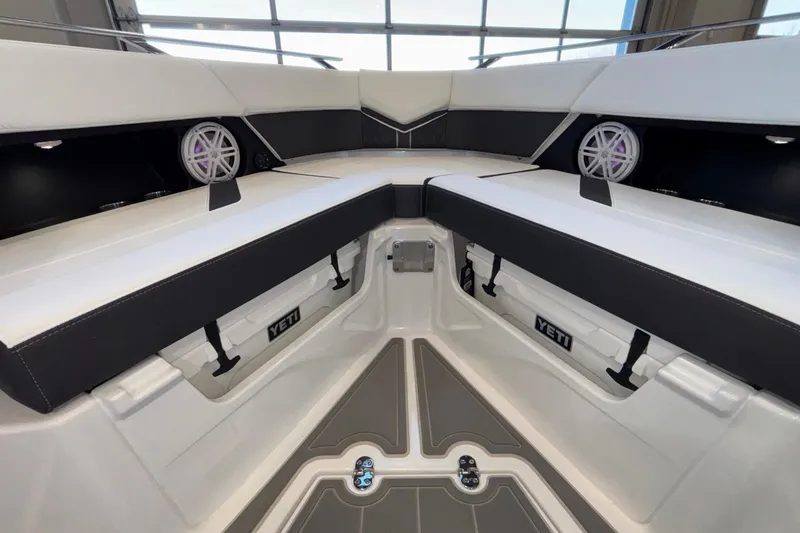  Yacht Photos Pics Interior of 2026 Monterey Elite 30 OB boat with seating and Yeti cooler storage.