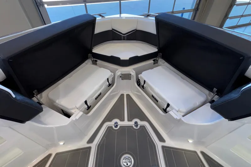  Yacht Photos Pics Interior view of 2026 Monterey Elite 30 OB boat with seating and storage compartments.