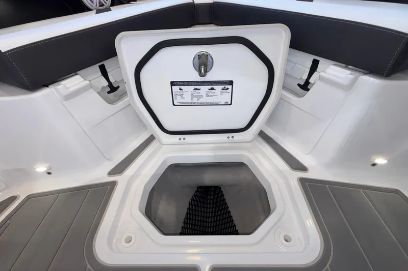  Yacht Photos Pics Open storage compartment on 2026 Monterey Elite 30 OB boat, featuring sleek interior design.