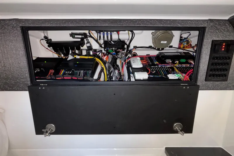  Yacht Photos Pics Electrical panel of 2026 Monterey Elite 30 OB boat, showcasing wiring and components.
