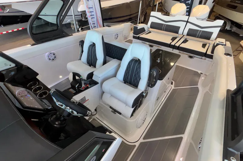  Yacht Photos Pics 2026 Monterey Elite 30 OB boat interior with luxury seating and modern dashboard.