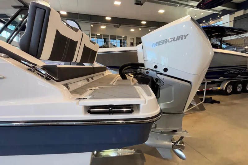  Yacht Photos Pics 2026 Monterey Elite 30 OB boat with Mercury outboard engine in showroom.