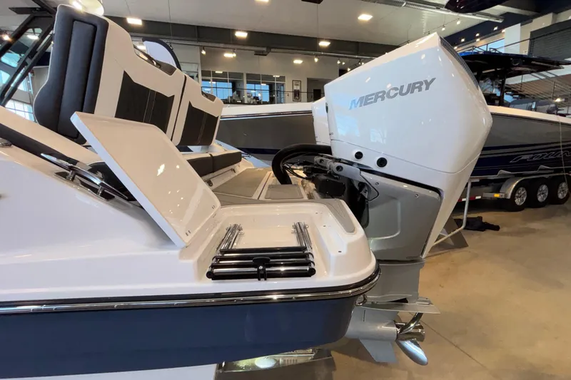  Yacht Photos Pics 2026 Monterey Elite 30 OB boat with Mercury outboard engine in showroom.
