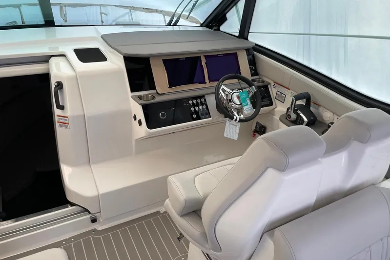  Yacht Photos Pics 2022 Sea Ray Sundancer 320 Outboard helm with dual screens and modern controls.