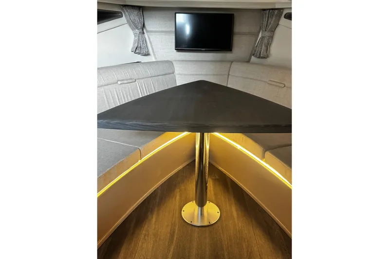  Yacht Photos Pics Interior of 2022 Sea Ray Sundancer 320 Outboard with modern seating and table.
