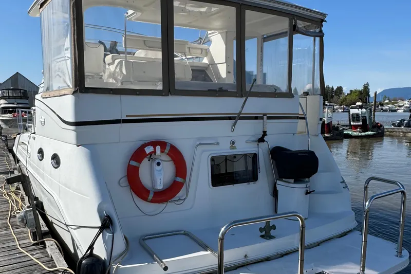  Yacht Photos Pics 2000 Sea Ray 380 Aft Cabin yacht docked at marina, rear view.
