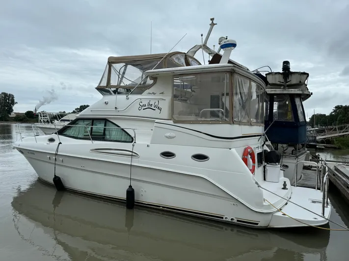  Yacht Photos Pics 2000 Sea Ray 380 Aft Cabin yacht docked on a cloudy day.