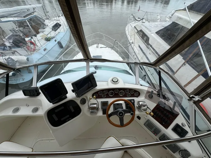  Yacht Photos Pics Cockpit view of 2000 Sea Ray 380 Aft Cabin yacht with navigation instruments.