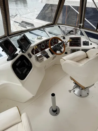  Yacht Photos Pics 2000 Sea Ray 380 Aft Cabin helm with steering wheel, controls, and navigation equipment.