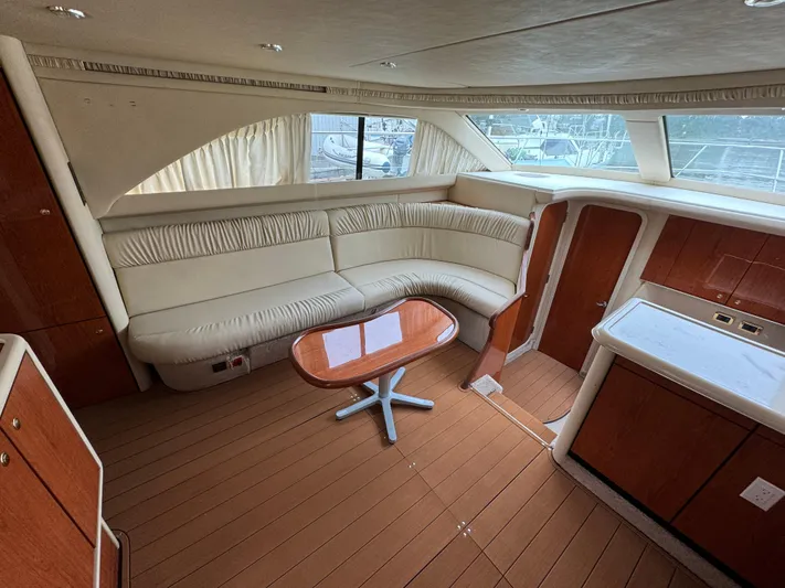  Yacht Photos Pics Luxurious interior of 2000 Sea Ray 380 Aft Cabin yacht with elegant seating and wood finishes.
