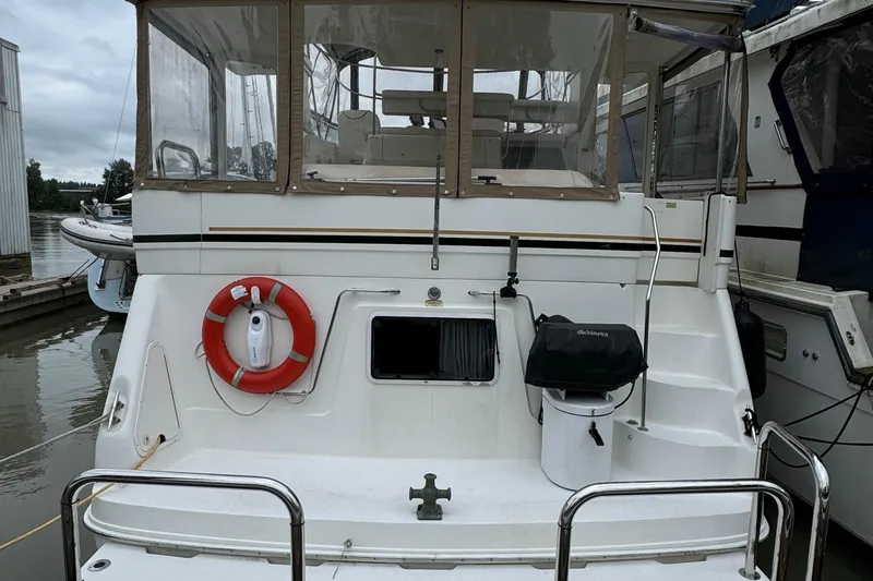  Yacht Photos Pics 2000 Sea Ray 380 Aft Cabin yacht with life preserver and grill on deck.