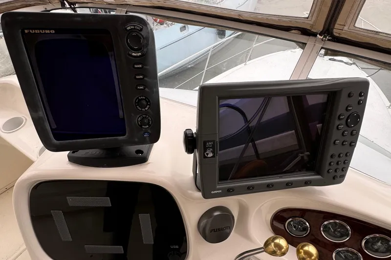  Yacht Photos Pics Control panel of a 2000 Sea Ray 380 Aft Cabin with navigation equipment.