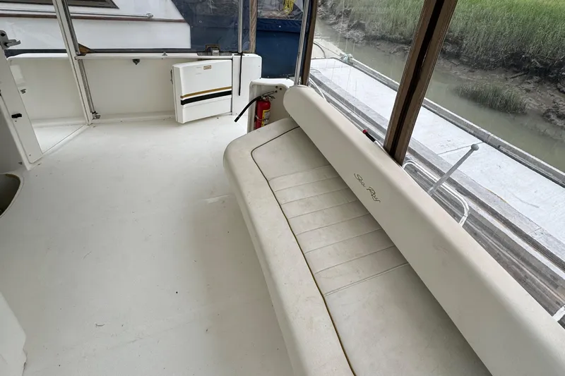  Yacht Photos Pics Interior of 2000 Sea Ray 380 Aft Cabin yacht with white seating and windows.