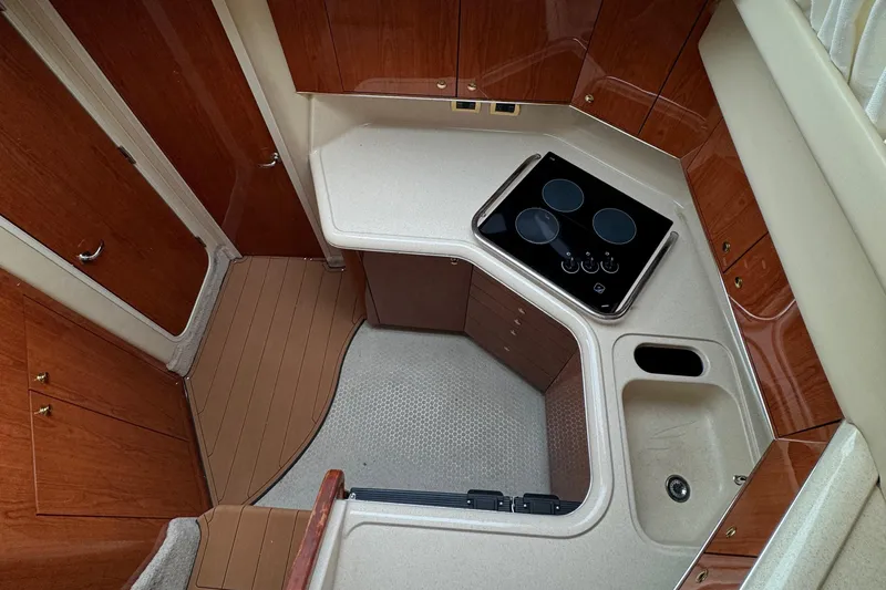  Yacht Photos Pics Interior of 2000 Sea Ray 380 Aft Cabin yacht with compact kitchen area.