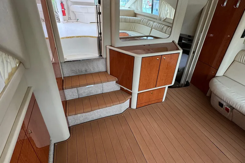  Yacht Photos Pics Interior of 2000 Sea Ray 380 Aft Cabin with wood flooring and seating area.
