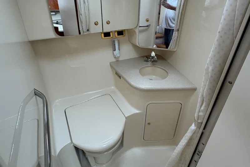  Yacht Photos Pics Bathroom interior of 2000 Sea Ray 380 Aft Cabin yacht, featuring sink and toilet.
