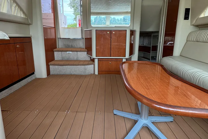  Yacht Photos Pics Interior of 2000 Sea Ray 380 Aft Cabin with wood flooring and seating area.