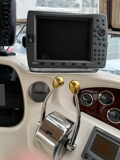  Yacht Photos Pics Control panel of a 2000 Sea Ray 380 Aft Cabin with navigation equipment.