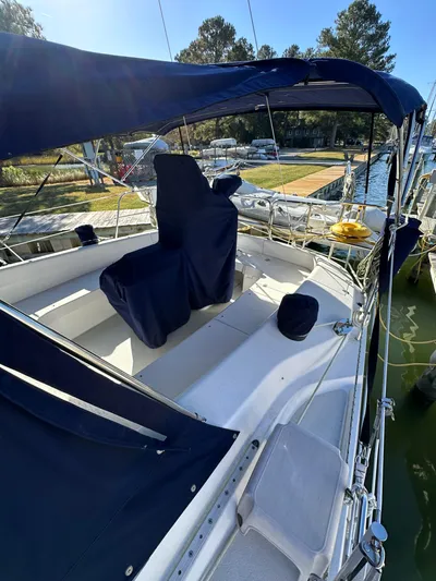 Chesapeake Free Yacht Photos Pics 2006 Catalina 387 sailboat with blue canopy docked at marina.