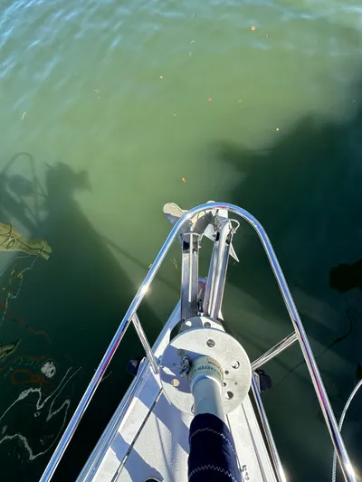 Chesapeake Free Yacht Photos Pics Bow of 2006 Catalina 387 sailboat with anchor over calm water.