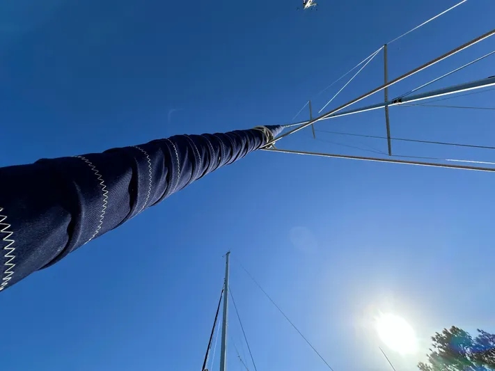 Chesapeake Free Yacht Photos Pics Sailboat mast of a 2006 Catalina 387 against a clear blue sky.
