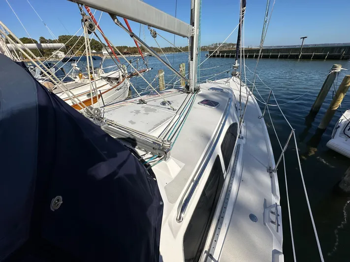 Chesapeake Free Yacht Photos Pics Sailboat Catalina 387, 2006 model, docked at marina with clear blue sky.